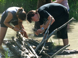 Building a fire in the river